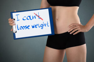 woman showing message i can t lose weight 3887430